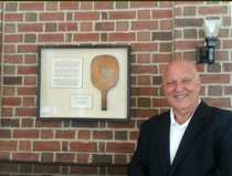 Jim McCormick with the display capturing the history of the game at Saddle and Cycle in the Klimley Sportshouse